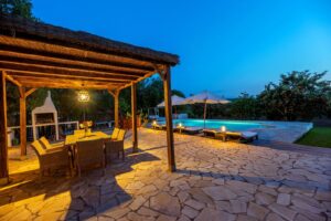 Luxury villa in Morna Valley, Santa Eulalia with 5 bedrooms, pool, Balinese bed, lush garden, and fruit trees, ideal for long-term rental in Ibiza.