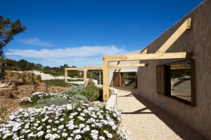 Exterior view of Casa Daniela in Formentera, a luxury villa rental with a private pool, garden, and stunning views of Ibiza and the Formentera countryside.