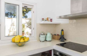 Modern fully equipped kitchen at Casa Nashamena in San Miguel, Ibiza, featuring luxury appliances and elegant design.