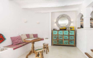 Spacious living room interior of Casa Nashamena with natural light and elegant decor.