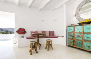Spacious living room interior of Casa Nashamena with natural light and elegant decor.