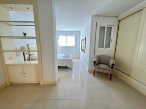 Elegant master bedroom in Talamanca Penthouse with panoramic views and modern decor.
