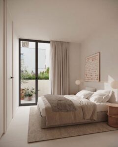 Spacious living room in a luxury Ibiza apartment with modern design, large windows, and stylish furniture.