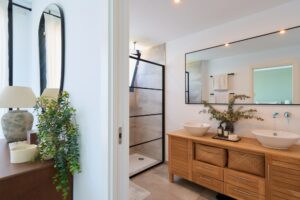 Sophisticated modern bathroom in Luxury Villa Jesús, Ibiza, featuring sleek finishes, a spacious walk-in shower, and high-end amenities.