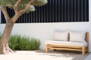 Small tree in the outdoor sitting area of Luxury Villa Jesús, Ibiza, adding greenery and enhancing the tranquil ambiance.