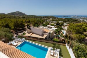 Aerial drone view of Luxury Casa Flamenc, Ibiza, showcasing the private pool and surrounding areas of the villa.