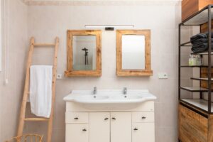 Elegant bathroom at Luxury Casa Flamenc, Ibiza, featuring a stylish vanity with a modern sink and sophisticated décor.