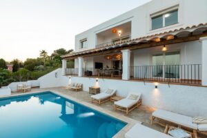 Stunning private pool at Luxury Casa Flamenc, Ibiza, featuring crystal-clear water, modern design, and lush outdoor surroundings.