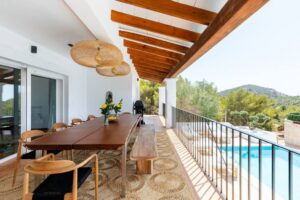 Outdoor dining area at Luxury Casa Flamenc, Ibiza, beautifully decorated for daytime meals with a relaxing ambiance.
