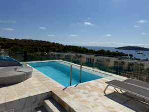 Rooftop infinity pool terrace with Dalt Vila skyline views at Penthouse Es Pouet Ibiza