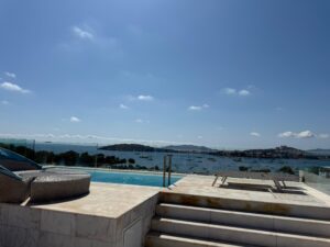 Rooftop infinity pool terrace with Dalt Vila skyline views at Penthouse Es Pouet Ibiza