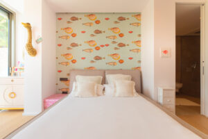 Master bedroom suite with king bed and sea views in Cap Martinet luxury villa
