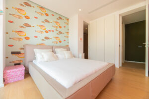 Master bedroom suite with king bed and sea views in Cap Martinet luxury villa