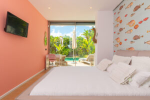 Master bedroom suite with king bed and sea views in Cap Martinet luxury villa