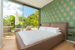 11. Master bedroom suite with king bed and sea views in Cap Martinet luxury villa