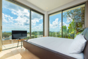 11. Master bedroom suite with king bed and sea views in Cap Martinet luxury villa