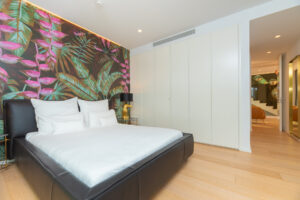 11. Master bedroom suite with king bed and sea views in Cap Martinet luxury villa